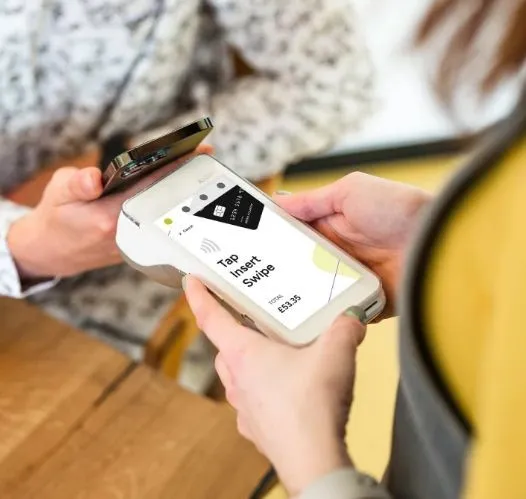 Hands using phone-based invoice payment and invoicing tools