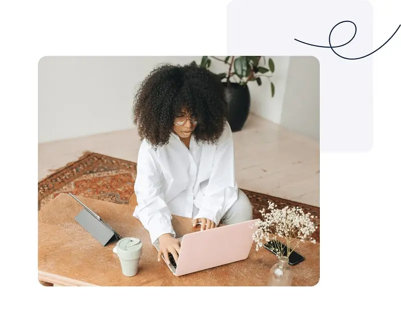 Business owner using a laptop and mobile banking tools
