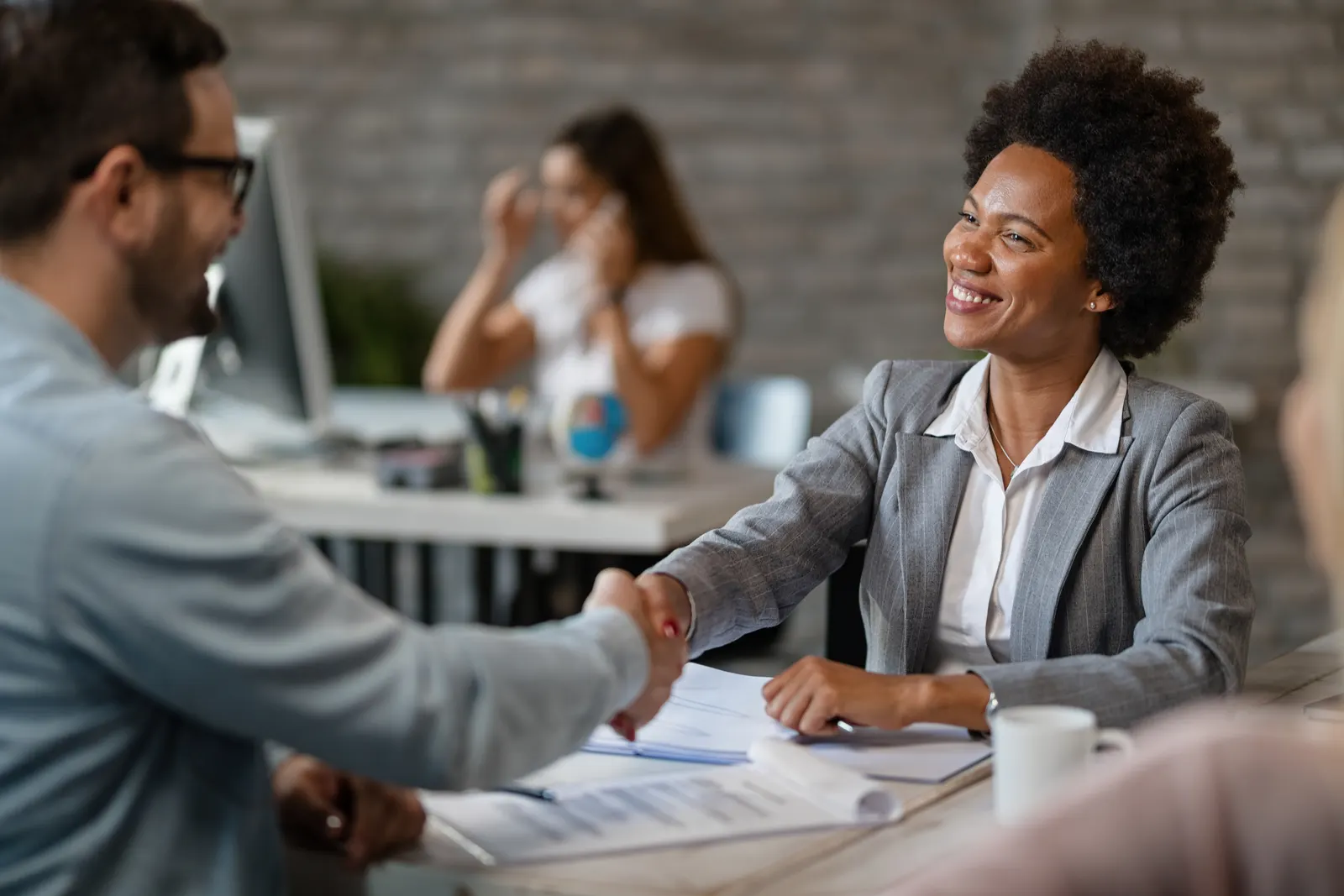 Business owner planning investment and loan options