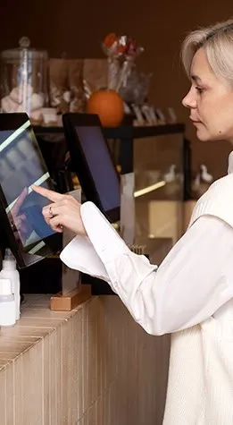 Hospitality staff member taking a card payment during service